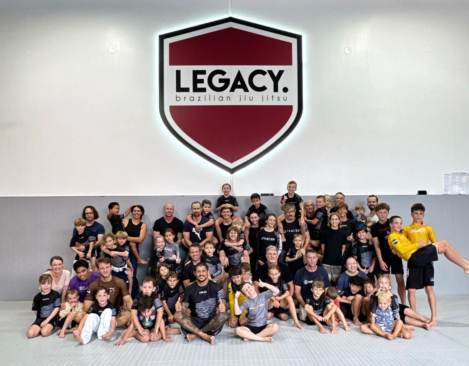 Dads and kids together on the mats at Legacy Jiu Jitsu Sunshine Coast