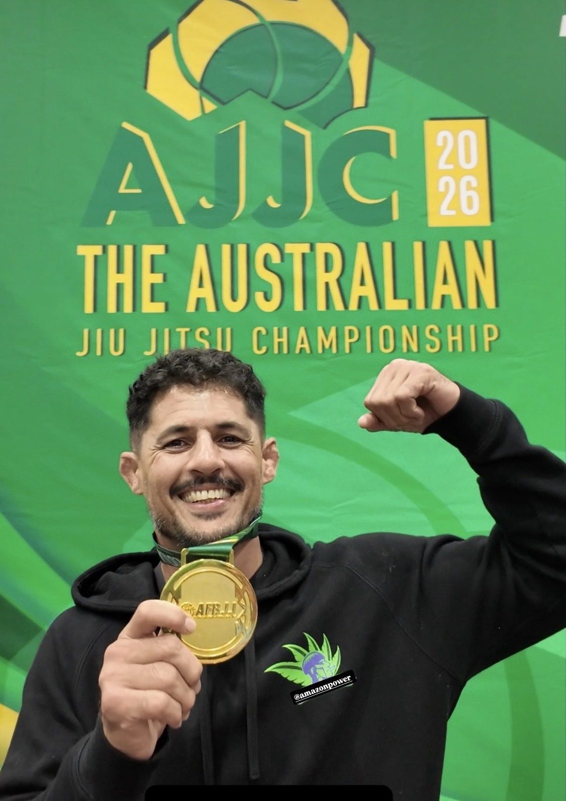 Professor Lucas holding his gold medal at the Australian Jiu Jitsu Championship 2026