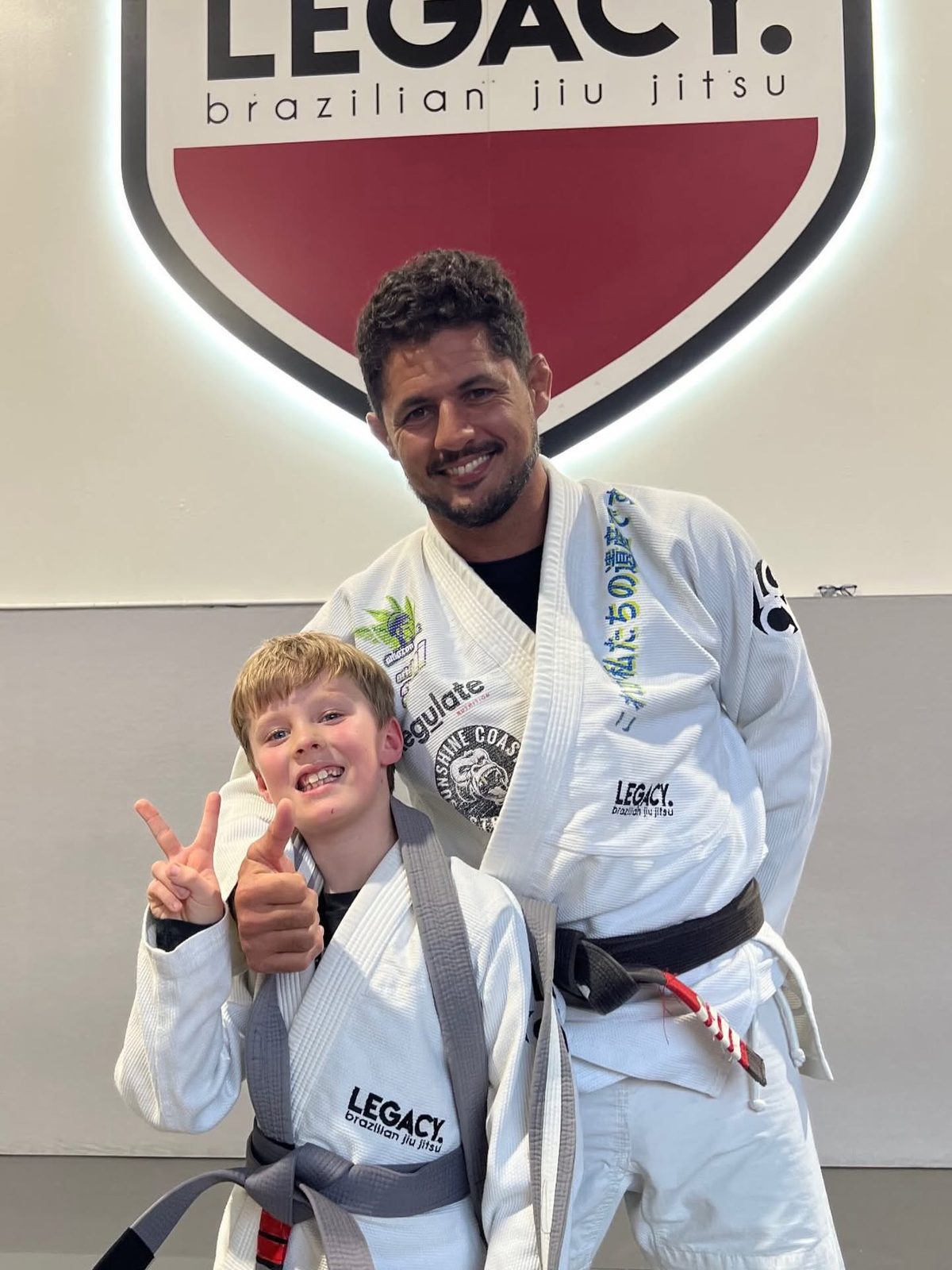 Xavier with coach Lucas at Legacy Jiu Jitsu